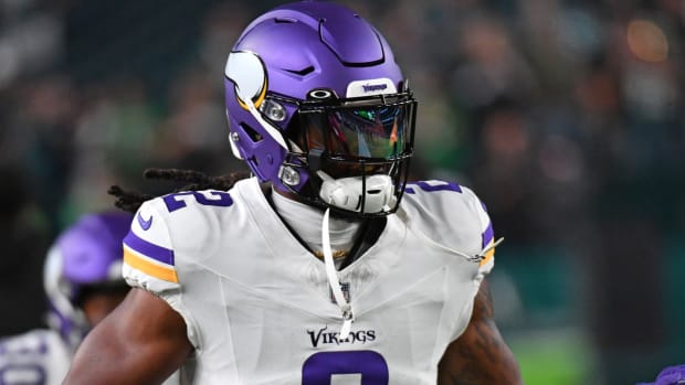 Vikings running back Alexander Mattison runs on the field.